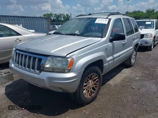 2004 Jeep Grand Cherokee Limited with VIN 1J4GW58N64C283657, listed as a IAAI auction lot 42542150 with 228,910 mi miles and . Bid and sale history available at DreamBid. Image 2.
