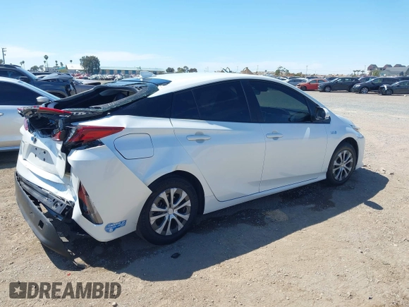 2021 Toyota Prius LE with VIN JTDKAMFP2M3184900, listed as a IAAI auction lot 42014569 with 81,563 mi miles and . Bid and sale history available at DreamBid. Image 4.
