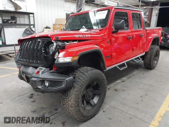 2022 Jeep Gladiator Altitude z VIN 1C6HJTAGXNL117353, wystawiony jako IAAI lot #42427921 z przebiegiem 28 801 mil mil oraz . Historia ofert i sprzedaży dostępna na DreamBid. Obrazek 17.