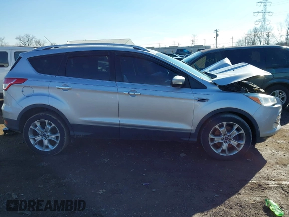 2015 Ford Escape Titanium with VIN 1FMCU0J93FUC02844, listed as a IAAI auction lot 41531293 with 115,392 mi miles and . Bid and sale history available at DreamBid. Image 14.