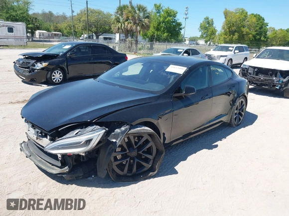 2021 Tesla Model S Plaid with VIN 5YJSA1E66MF452258, listed as a IAAI auction lot 41832000 with 42,845 mi miles and . Bid and sale history available at DreamBid. Image 18.