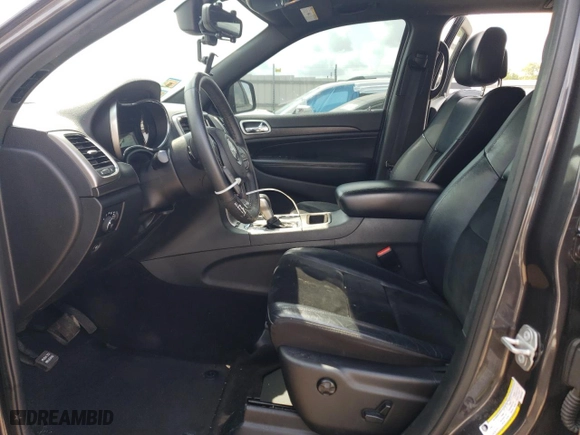 2018 Jeep Grand Cherokee Laredo E with VIN 1C4RJFAG6JC387334, listed as a Copart auction lot 64197034 with 57,992 mi miles and Salvage Title. Bid and sale history available at carsss.com. Image 7.