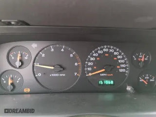 1999 Jeep Grand Cherokee Laredo with VIN 1J4GW58SXXC553547, listed as a Copart auction lot 50786405 with 151,968 mi miles and Salvage Title. Bid and sale history available at carsss.com. Image 9.