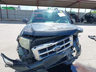 2008 Ford Escape XLS z VIN 1FMCU02Z28KD32661, wystawiony jako IAAI lot #42316426 z przebiegiem 184 552 mil mil oraz . Historia ofert i sprzedaży dostępna na DreamBid. Obrazek 13.