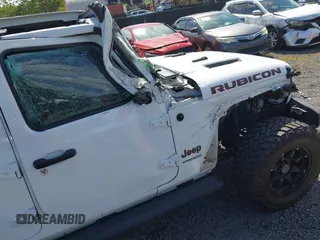 2022 Jeep Wrangler Unlimited Rubicon with VIN 1C4HJXFG8NW130156, listed as a IAAI auction lot 42004630 with 129,313 mi miles and . Bid and sale history available at DreamBid. Image 18.