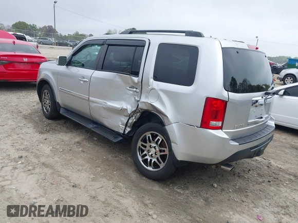 2014 Honda Pilot Touring with VIN 5FNYF4H91EB011934, listed as a IAAI auction lot 41929415 with 227,343 mi miles and . Bid and sale history available at DreamBid. Image 3.