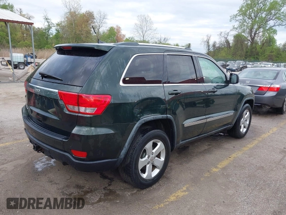 2011 Jeep Grand Cherokee 70th Anniversary with VIN 1J4RR4GG3BC631831, listed as a IAAI auction lot 42038415 with 130,811 mi miles. Bid and sale history available at carsss.com. Image 4.