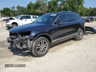 2015 Volkswagen Touareg Lux с VIN WVGEP9BP4FD004212, выставлен на аукционе Copart как лот 54021345 с пробегом 156 164 миль миль и Списание • Salvage title. История ставок и продаж доступна на DreamBid. Изображение 1.