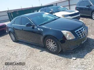 2013 Cadillac CTS Luxury with VIN 1G6DE5E55D0118722, listed as a IAAI auction lot 42448616 with 131,906 mi miles and . Bid and sale history available at DreamBid. Image 1.