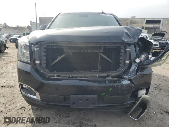 2015 GMC Yukon Denali with VIN 1GKS1CKJ1FR303049, listed as a Copart auction lot 82435514 with 100,693 mi miles and Salvage Title. Bid and sale history available at carsss.com. Image 5.