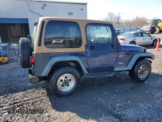 1997 Jeep Wrangler Sport with VIN 1J4FY19S2VP498840, listed as a Copart auction lot 50058885 with 151,697 mi miles and Salvage Title. Bid and sale history available at carsss.com. Image 3.