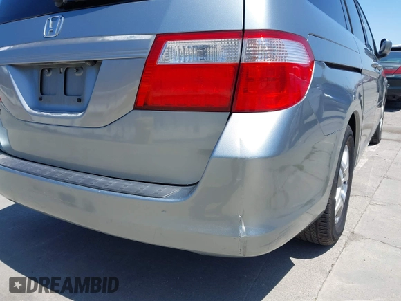 2006 Honda Odyssey EX-L z VIN 5FNRL38716B051664, wystawiony jako IAAI lot #42520320 z przebiegiem 304 835 mil mil oraz . Historia ofert i sprzedaży dostępna na DreamBid. Obrazek 6.