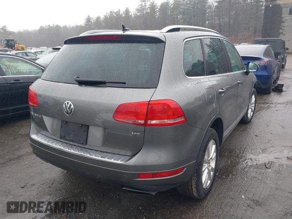 2013 Volkswagen Touareg Lux with VIN WVGEF9BP7DD007170, listed as a IAAI auction lot 41787075 with 131,089 mi miles and . Bid and sale history available at DreamBid. Image 4.