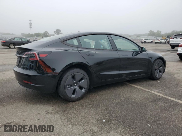 2023 Tesla Model 3 with VIN 5YJ3E1EA9PF687187, listed as a Copart auction lot 61044055 with 7,007 mi miles and Salvage title. Bid and sale history available at DreamBid. Image 3.