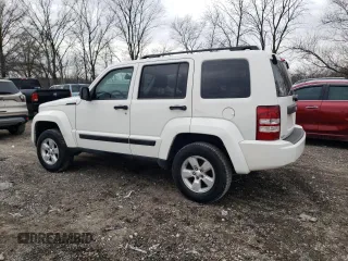 2010 Jeep Liberty Sport with VIN 1J4PP2GK9AW133958, listed as a Copart auction lot 47265675 with 124,466 mi miles and Salvage Title. Bid and sale history available at DreamBid. Image 2.