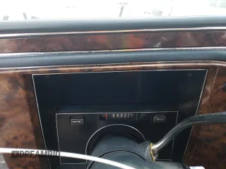 1991 Cadillac Brougham z VIN 1G6DW54E6MR710852, wystawiony jako Copart lot #76027004 z przebiegiem Nie podano mil oraz Szkody całkowita. Historia ofert i sprzedaży dostępna na DreamBid. Obrazek 9.
