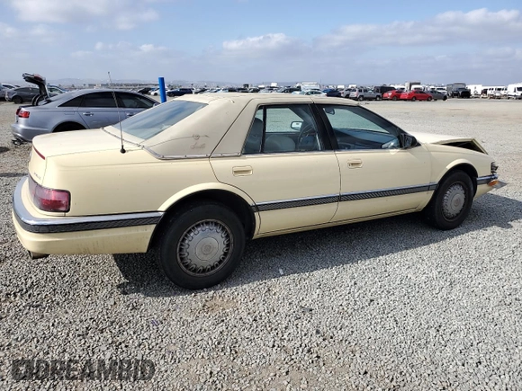 1992 Cadillac Seville z VIN 1G6KS53B0NU837105, wystawiony jako Copart lot #55865205 z przebiegiem 94 740 mil mil oraz Szkody całkowita. Historia ofert i sprzedaży dostępna na DreamBid. Obrazek 3.