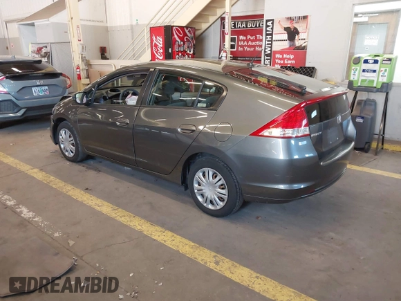 2010 Honda Insight LX with VIN JHMZE2H54AS040316, listed as a IAAI auction lot 41572246 with 142,850 mi miles and . Bid and sale history available at DreamBid. Image 3.