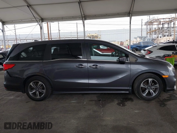 2019 Honda Odyssey Touring z VIN 5FNRL6H88KB037149, wystawiony jako IAAI lot #42356871 z przebiegiem 64 549 mil mil oraz . Historia ofert i sprzedaży dostępna na DreamBid. Obrazek 13.