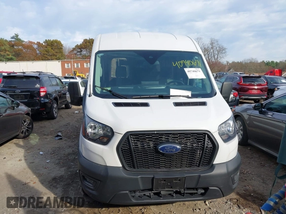 2023 Ford Transit Cargo with VIN 1FTBR1C86PKA52494, listed as a IAAI auction lot 40740671 with 9,999 mi miles and . Bid and sale history available at DreamBid. Image 12.