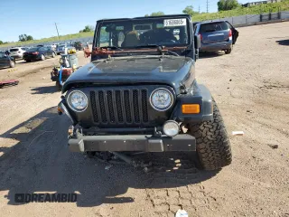 2004 Jeep Wrangler Sport with VIN 1J4FA49S04P751464, listed as a Copart auction lot 61686865 with Not provided miles and Salvage title. Bid and sale history available at DreamBid. Image 5.
