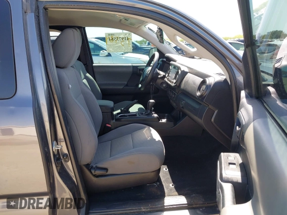 2020 Toyota Tacoma SR with VIN 3TYRX5GNXLT002488, listed as a IAAI auction lot 41973584 with 76,169 mi miles and . Bid and sale history available at DreamBid. Image 5.