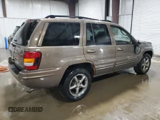 2002 Jeep Grand Cherokee Limited with VIN 1J4GW58NX2C248892, listed as a Copart auction lot 55574615 with 164,010 mi miles and Salvage title. Bid and sale history available at DreamBid. Image 3.