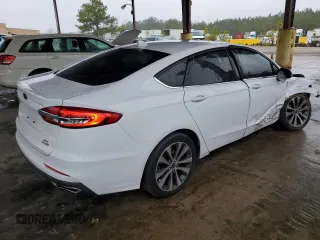 2020 Ford Fusion SE z VIN 3FA6P0T92LR173321, wystawiony jako Copart lot #86585494 z przebiegiem 102 285 mil mil oraz Szkoda całkowita • Salvage title. Historia ofert i sprzedaży dostępna na DreamBid. Obrazek 3.