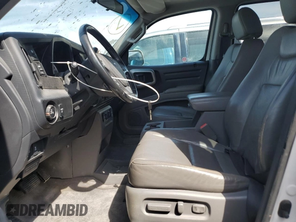 2012 Honda Ridgeline RTL with VIN 5FPYK1F59CB501178, listed as a Copart auction lot 60634535 with 165,766 mi miles and Salvage title. Bid and sale history available at DreamBid. Image 7.