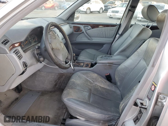 2000 Mercedes-Benz E-Class with VIN WDBJF70JXYB113988, listed as a Copart auction lot 86325514 with 198,321 mi miles and Salvage Title. Bid and sale history available at carsss.com. Image 7.
