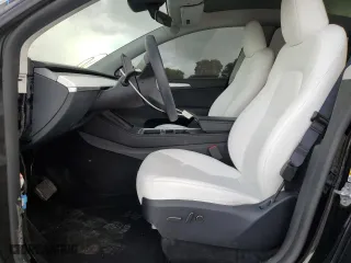 2023 Tesla Model Y Long Range with VIN 7SAYGDEE3PF938230, listed as a Copart auction lot 47883385 with 28,461 mi miles and Salvage Title. Bid and sale history available at carsss.com. Image 7.