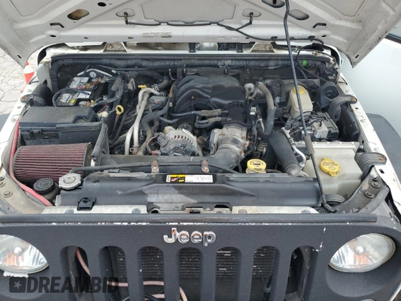 2015 Jeep Wrangler Unlimited Sport с VIN 1C4BJWDG3FL570131, выставлен на аукционе Copart как лот 64418415 с пробегом 112 362 миль миль и Списание • Salvage title. История ставок и продаж доступна на DreamBid. Изображение 12.