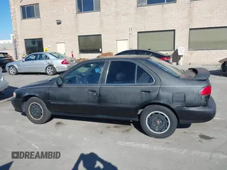 1998 Nissan Sentra XE z VIN 1N4AB41D8WC757796, wystawiony jako IAAI lot #41209171 z przebiegiem 160 108 mil mil oraz . Historia ofert i sprzedaży dostępna na DreamBid. Obrazek 14.