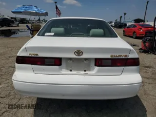 1998 Toyota Camry LE z VIN JT2BG22K4W0197464, wystawiony jako Copart lot #54768195 z przebiegiem Nie podano mil oraz Czysty tytuł • Clean title. Historia ofert i sprzedaży dostępna na DreamBid. Obrazek 6.