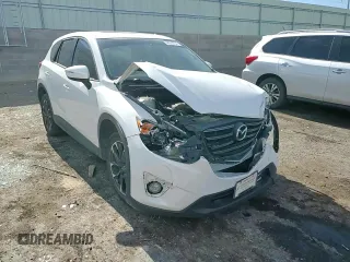 2016 Mazda CX-5 Grand Touring with VIN JM3KE2DY0G0888854, listed as a Copart auction lot 68379754 with 73,096 mi miles and Salvage Title. Bid and sale history available at carsss.com. Image 12.