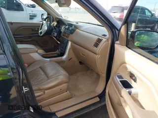 2005 Honda Pilot EX-L with RES with VIN 2HKYF18605H545609, listed as a IAAI auction lot 41626754 with 235,647 mi miles. Bid and sale history available at carsss.com. Image 5.