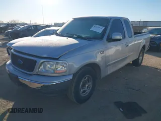 1999 Ford F-150 with VIN 1FTZX1729XKA58767, listed as a IAAI auction lot 41392815 with 342,029 mi miles and . Bid and sale history available at DreamBid. Image 2.