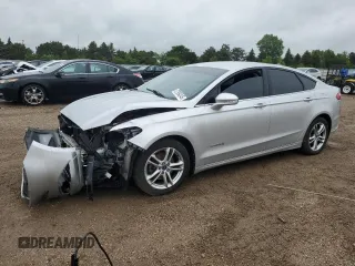 2013 Ford Fusion SE Hybrid z VIN 3FA6P0LU9DR233472, wystawiony jako Copart lot #57994345 z przebiegiem 194 862 mil mil oraz Szkoda całkowita • Salvage title. Historia ofert i sprzedaży dostępna na DreamBid. Obrazek 1.