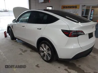 2023 Tesla Model Y Long Range with VIN 7SAYGDEE7PA100523, listed as a IAAI auction lot 40399455 with 18,885 mi miles and . Bid and sale history available at DreamBid. Image 3.