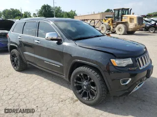 2014 Jeep Grand Cherokee Overland with VIN 1C4RJFCG6EC547604, listed as a Copart auction lot 55824944 with 128,330 mi miles and Clean Title. Bid and sale history available at carsss.com. Image 4.