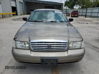 2005 Ford Crown Victoria Standard с VIN 2FAFP73WX5X144927, выставлен на аукционе Copart как лот 59713204 с пробегом 160 270 миль миль и Списание • Salvage title. История ставок и продаж доступна на DreamBid. Изображение 5.