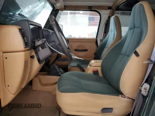 1998 Jeep Wrangler Sahara z VIN 1J4FY49S4WP728476, wystawiony jako Copart lot #53490515 z przebiegiem 272 058 mil mil oraz Czysty tytuł • Clean title. Historia ofert i sprzedaży dostępna na DreamBid. Obrazek 7.