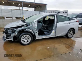2021 Toyota Prius L Eco z VIN JTDKAMFU1M3142014, wystawiony jako Copart lot #55038365 z przebiegiem 76 211 mil mil oraz Szkoda całkowita • Salvage title. Historia ofert i sprzedaży dostępna na DreamBid. Obrazek 1.