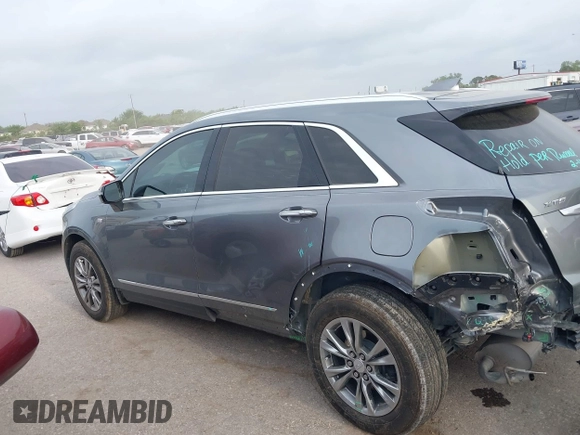 2021 Cadillac XT5 FWD Premium Luxury with VIN 1GYKNCRS5MZ128908, listed as a IAAI auction lot 41919571 with 51,280 mi miles and . Bid and sale history available at carsss.com. Image 15.