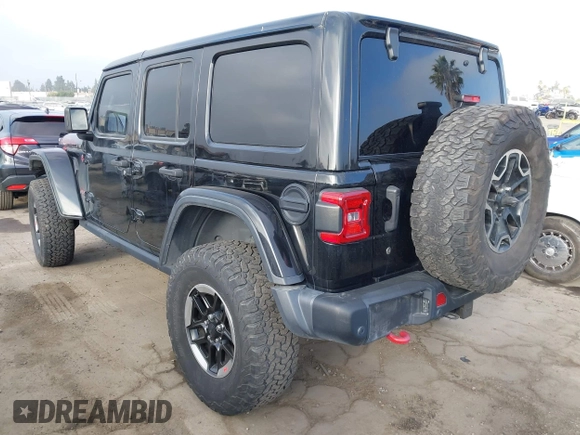 2020 Jeep Wrangler Unlimited Rubicon with VIN 1C4HJXFG1LW141335, listed as a IAAI auction lot 42724973 with 59,843 mi miles and . Bid and sale history available at DreamBid. Image 3.