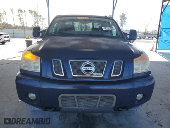 2010 Nissan Titan LE with VIN 1N6BA0EC2AN318776, listed as a Copart auction lot 46702485 with 111,149 mi miles and Salvage Title. Bid and sale history available at carsss.com. Image 5.