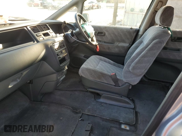 1997 Honda Odyssey with VIN RA11239041, listed as a Copart auction lot 85819024 with 79,952 mi miles and Salvage title. Bid and sale history available at DreamBid. Image 7.