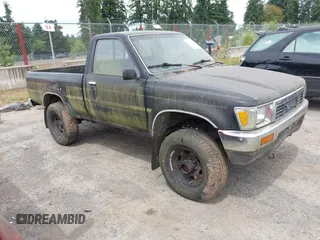 1989 Toyota Pickup DX with VIN JT4RN01P1K4009953, listed as a IAAI auction lot 42783233 with 162,519 mi miles and . Bid and sale history available at DreamBid. Image 1.