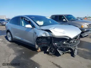 2016 Tesla Model X 70D with VIN 5YJXCAE21GF033123, listed as a IAAI auction lot 39813497 with 162,509 mi miles. Bid and sale history available at carsss.com. Image 1.