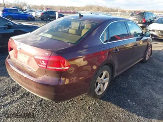 2013 Volkswagen Passat SE w/Sunroof with VIN 1VWBP7A31DC126908, listed as a IAAI auction lot 41216276 with 145,699 mi miles. Bid and sale history available at carsss.com. Image 4.